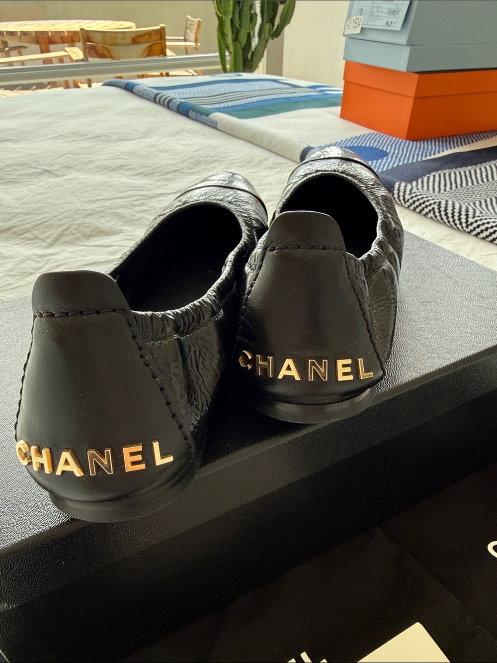 CHANEL Black Leather Slip-On Loafers with Gold Heel Logo - Picture 2 of 9